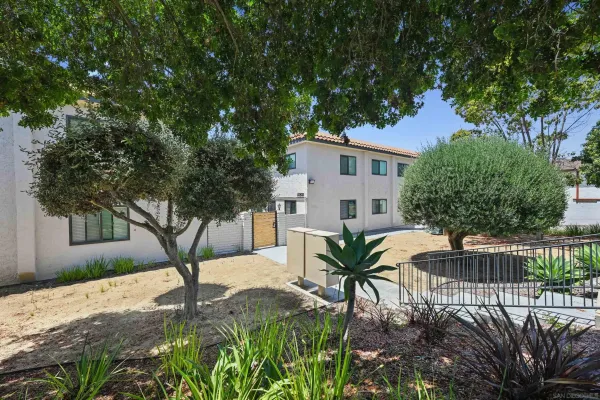 a view of backyard with patio and outdoor seating