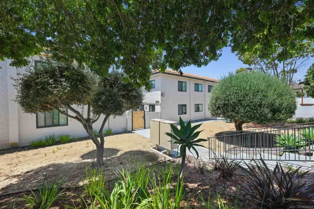 a view of backyard with patio and outdoor seating