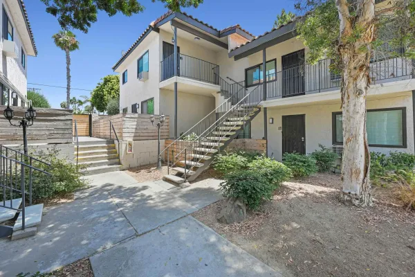a brick building with a bench in front of it
