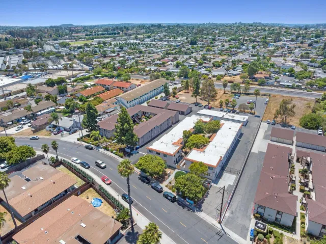 an aerial view of residential houses with outdoor space
