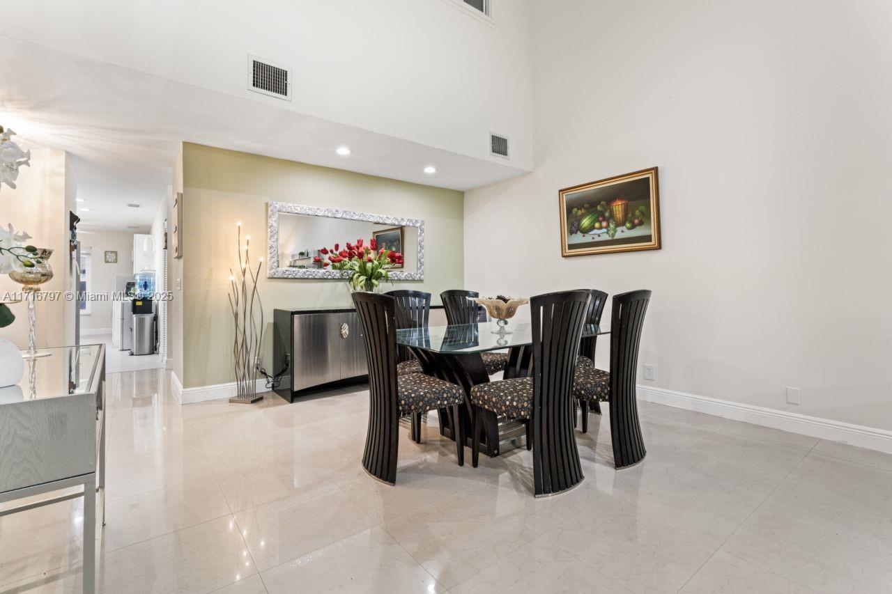 20929 Boca Ridge Drive West Boca Raton, FL 33428 - Photo 11 of 47 a view of a dining room with furniture