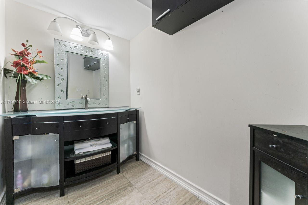 20929 Boca Ridge Drive West Boca Raton, FL 33428 - Photo 24 of 47 a bathroom with a sink and a mirror