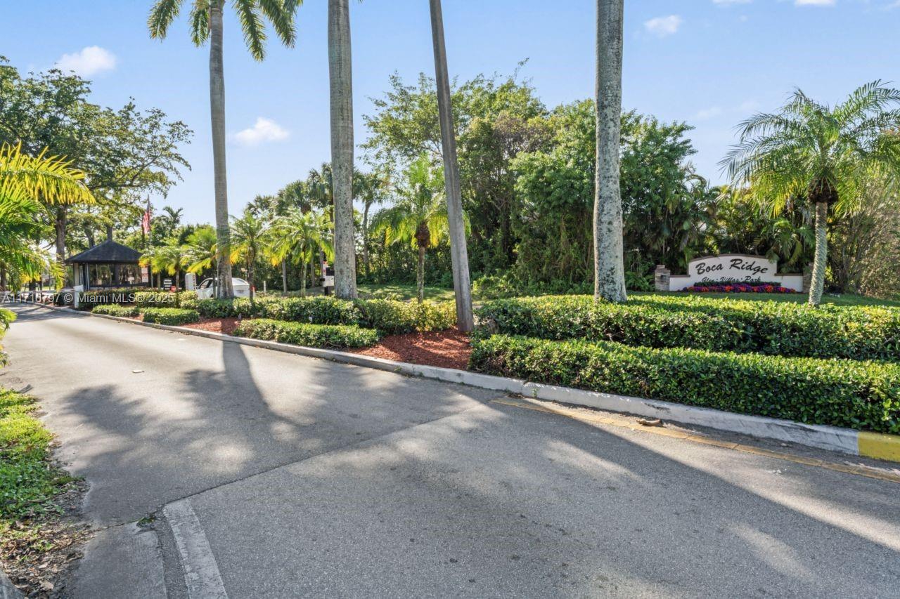 20929 Boca Ridge Drive West Boca Raton, FL 33428 - Photo 47 of 47 a view of a street with a building and a street view