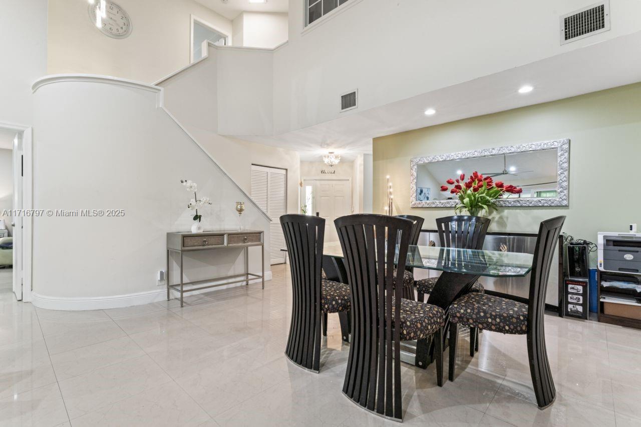 20929 Boca Ridge Drive West Boca Raton, FL 33428 - Photo 10 of 47 a view of a dining room with furniture