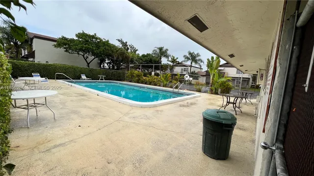 a view of swimming pool from a balcony