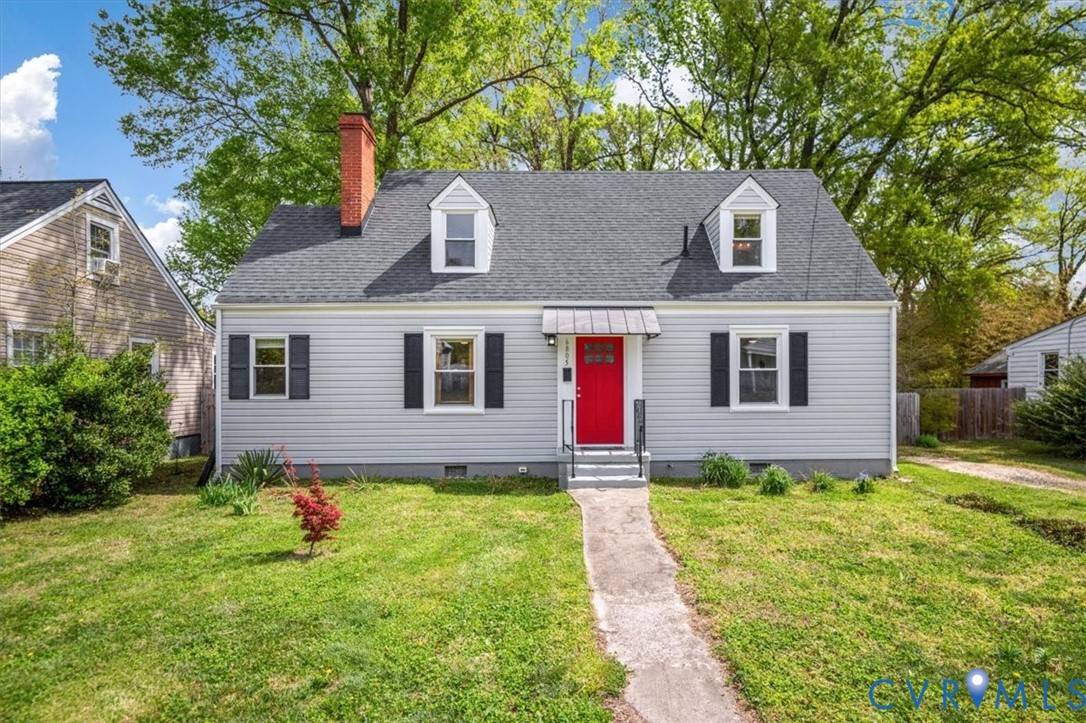 6805 Hermitage Road Henrico, VA 23228 - Photo 1 of 46 a front view of a house with a yard and garage