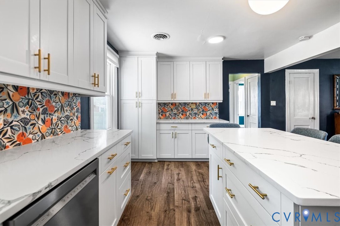 6805 Hermitage Road Henrico, VA 23228 - Photo 14 of 46 a kitchen with granite countertop white cabinets and white appliances
