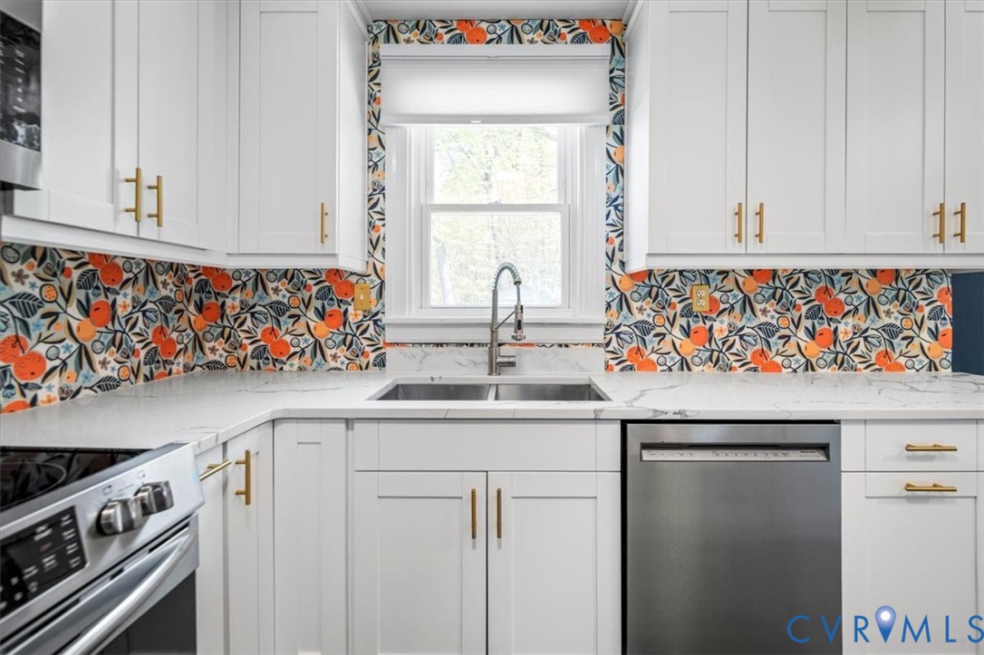6805 Hermitage Road Henrico, VA 23228 - Photo 15 of 46 a kitchen with stainless steel appliances granite countertop a sink and a window
