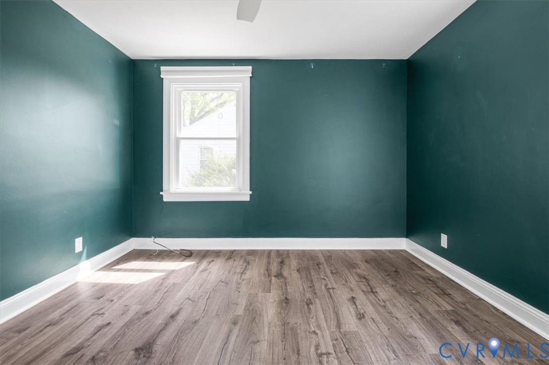 6805 Hermitage Road Henrico, VA 23228 - Photo 28 of 46 an empty room with wooden floor and windows