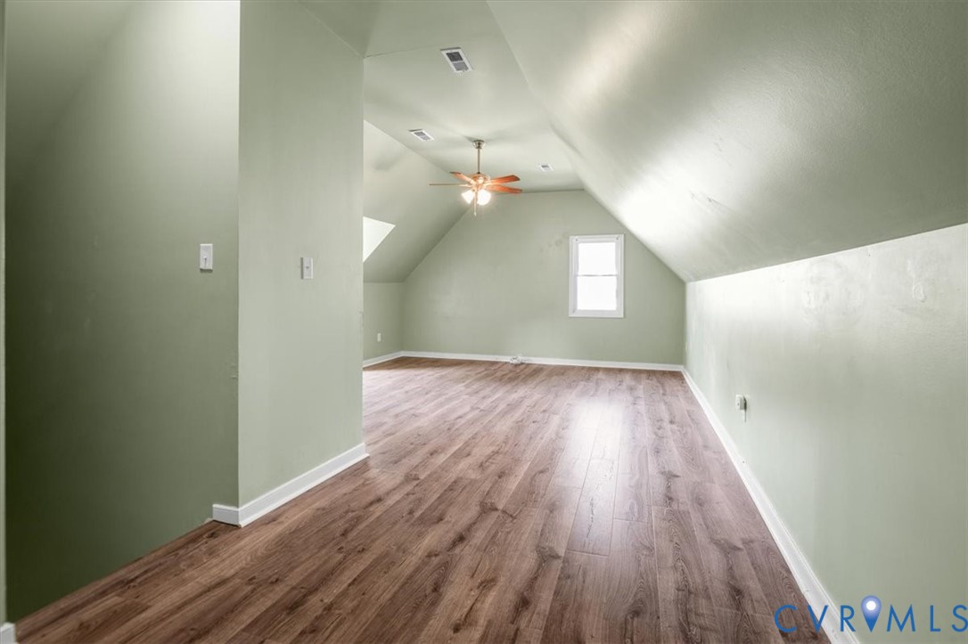 6805 Hermitage Road Henrico, VA 23228 - Photo 32 of 46 wooden floor in an empty room with a window