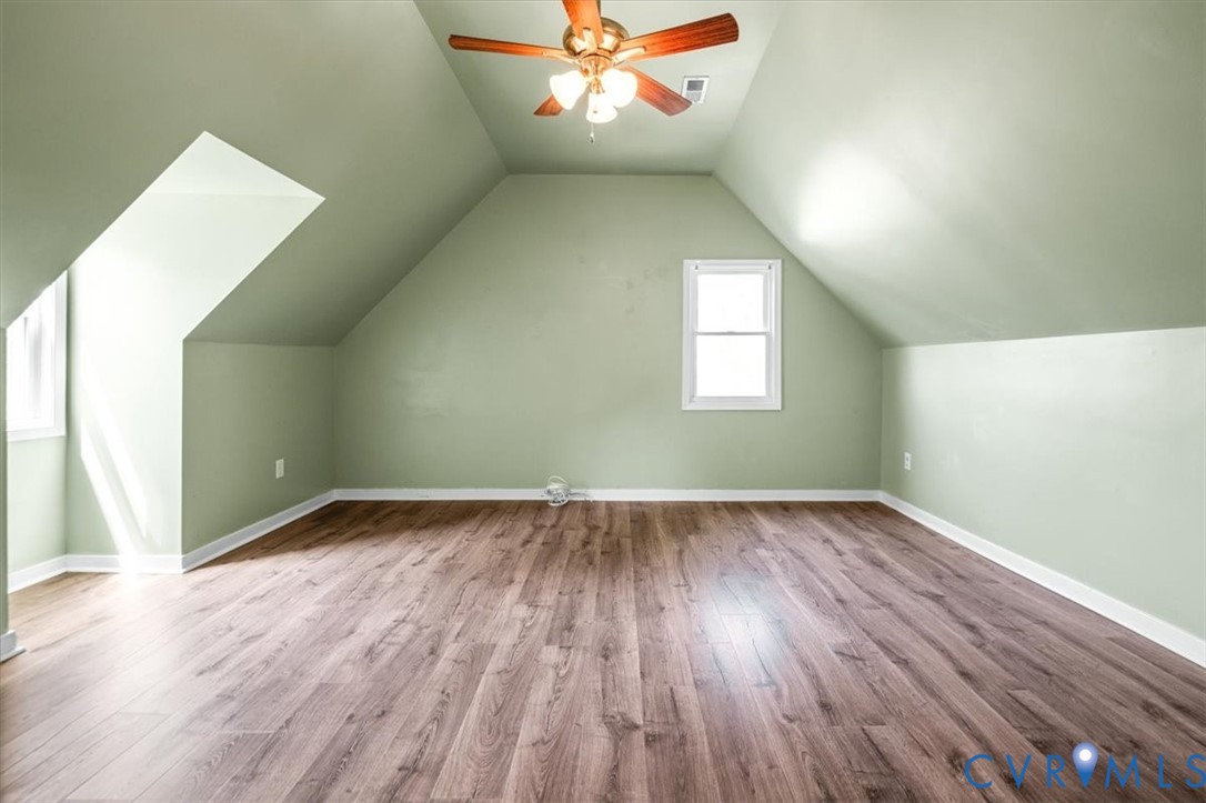 6805 Hermitage Road Henrico, VA 23228 - Photo 34 of 46 an empty room with wooden floor and windows