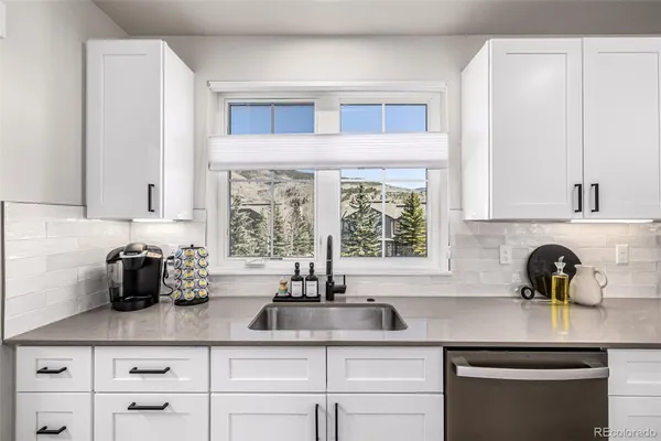 a kitchen with a sink and cabinets