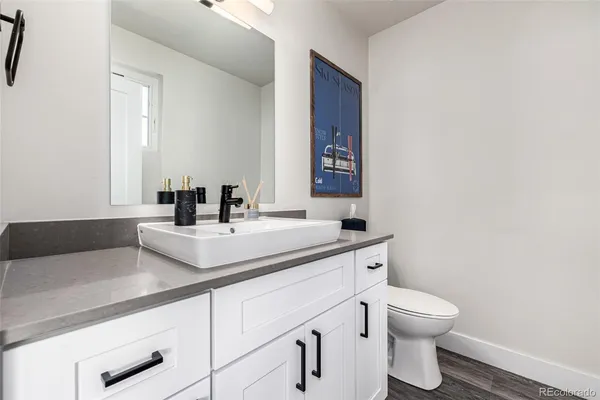 a bedroom with a bed a couch and a window