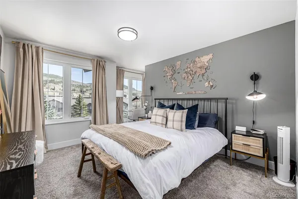 a bedroom with a bed and window