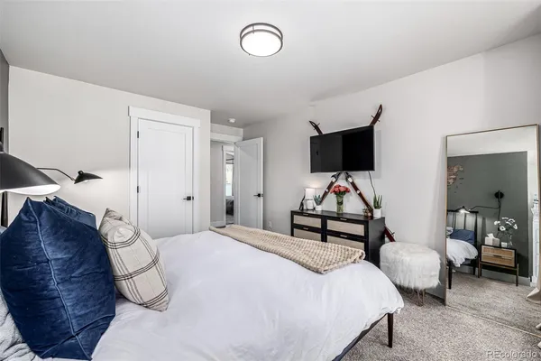 a bedroom with bed and a night stand