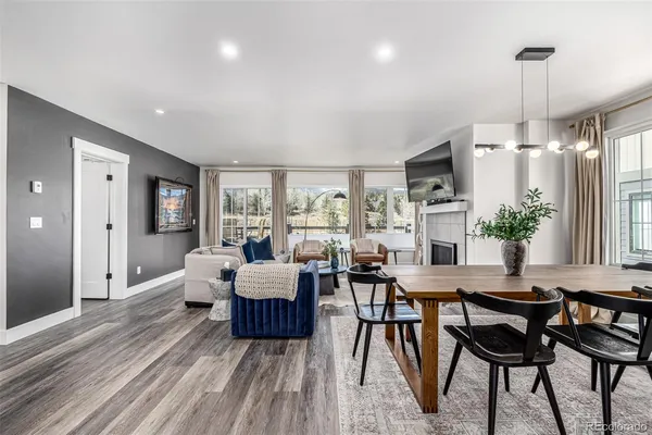 a view of a dining room with furniture window and wooden floor