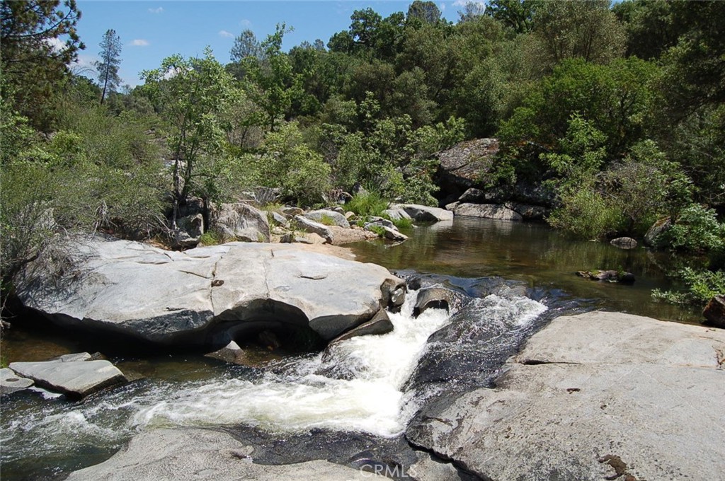 4812 Pegleg Road Mariposa, CA 95338 - Photo 1 of 1 This beautiful river pool borders the subject property. At approximately the top of the white water waterfall is the property line to the neighboring property according to the owner of this property.