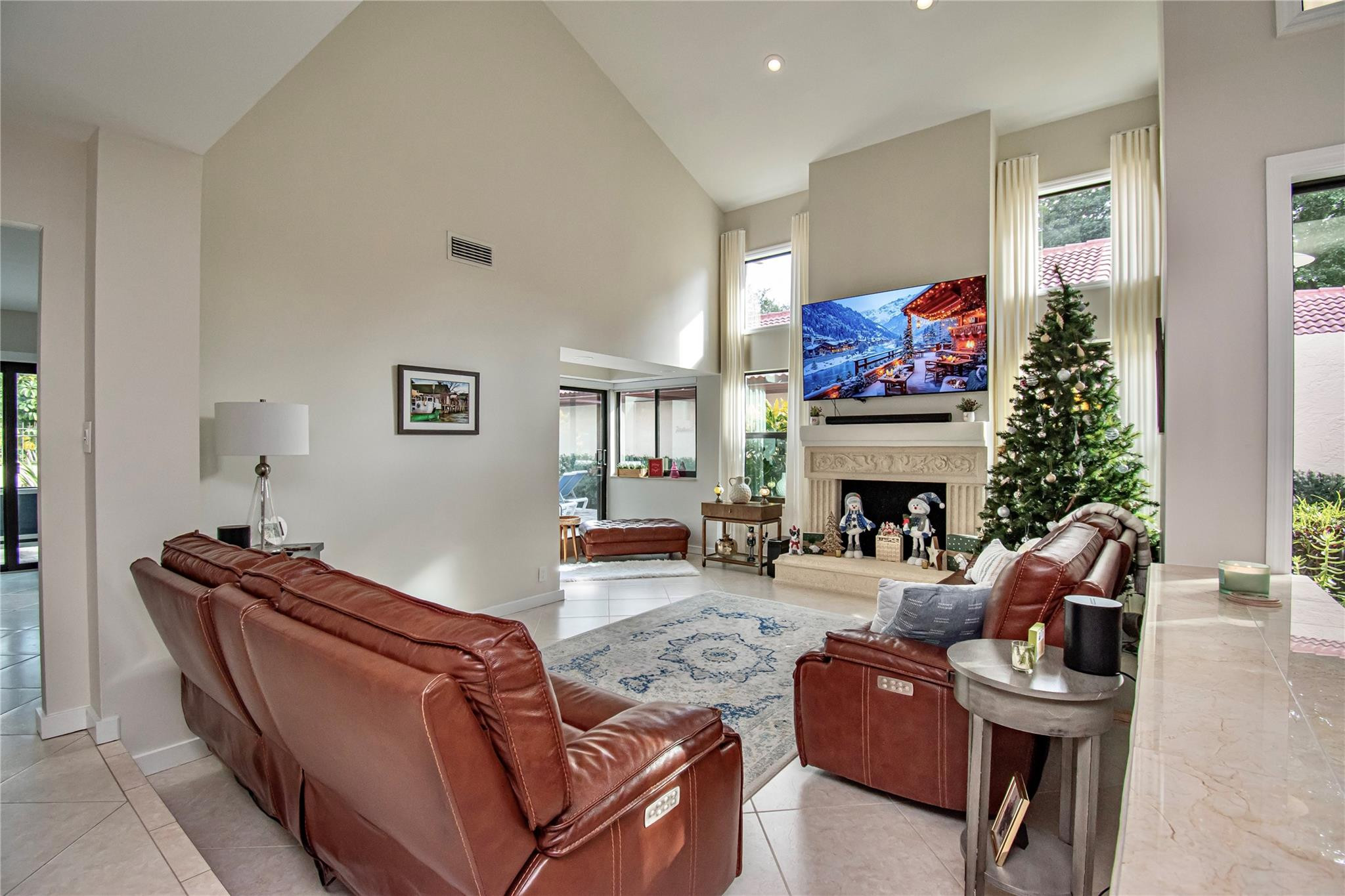 21694 Town Pl Drive Boca Raton, FL 33433 - Photo 11 of 55 a living room with furniture a fireplace and a window