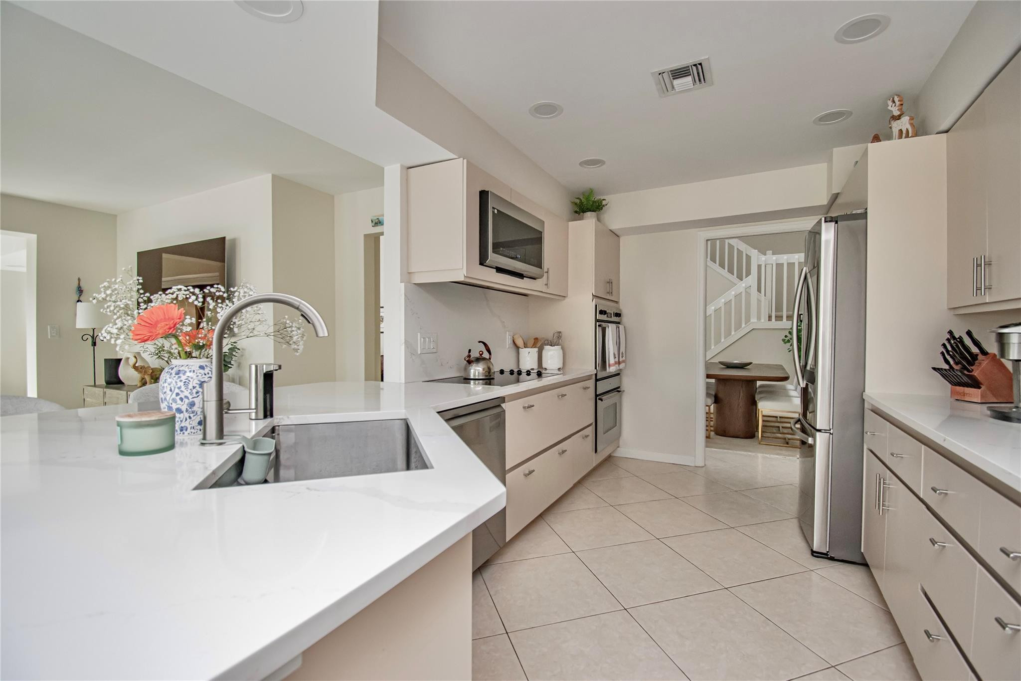 21694 Town Pl Drive Boca Raton, FL 33433 - Photo 24 of 55 a kitchen with stainless steel appliances granite countertop a sink and cabinets
