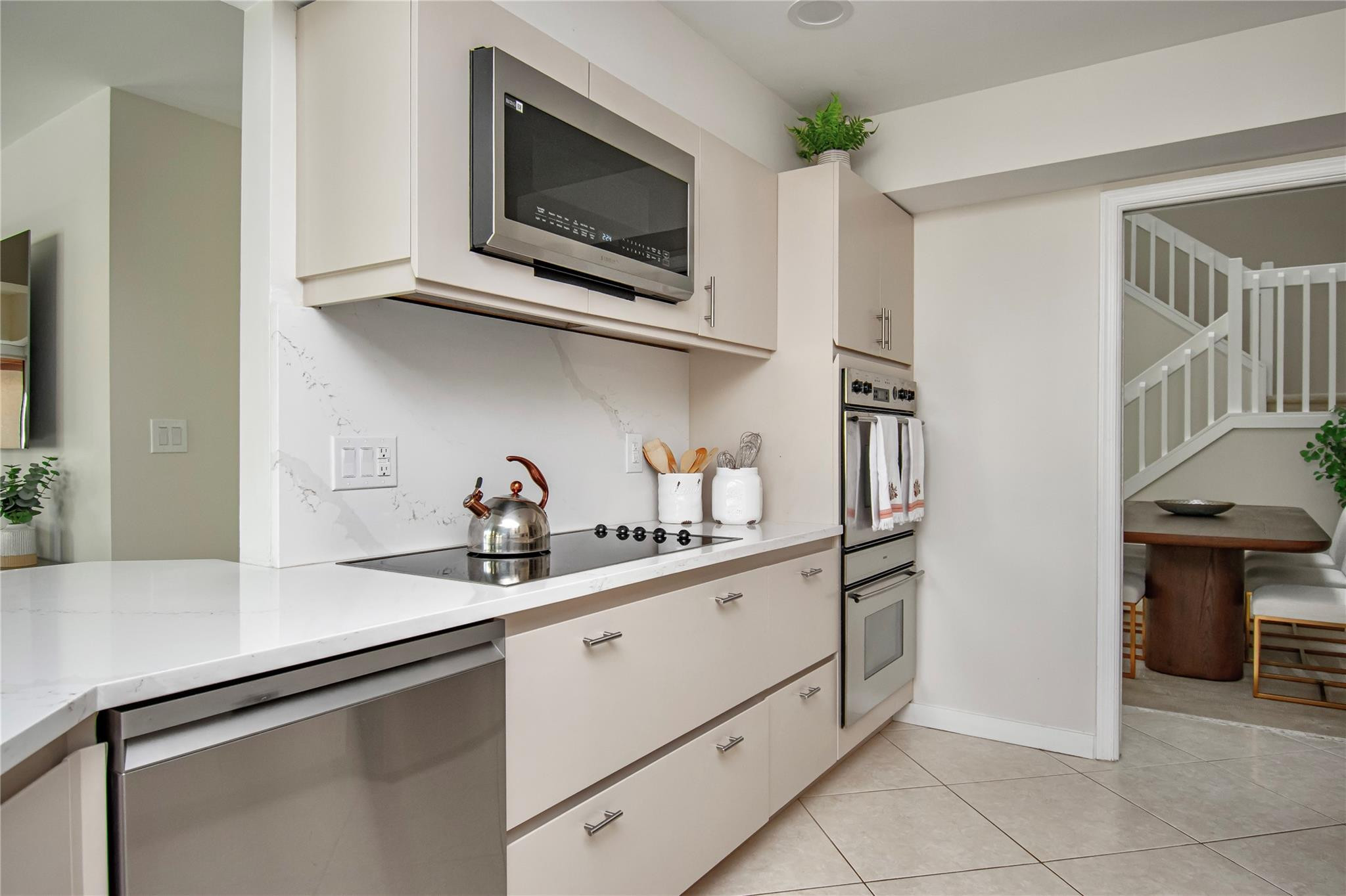 21694 Town Pl Drive Boca Raton, FL 33433 - Photo 25 of 55 a kitchen with stainless steel appliances granite countertop a sink and a microwave