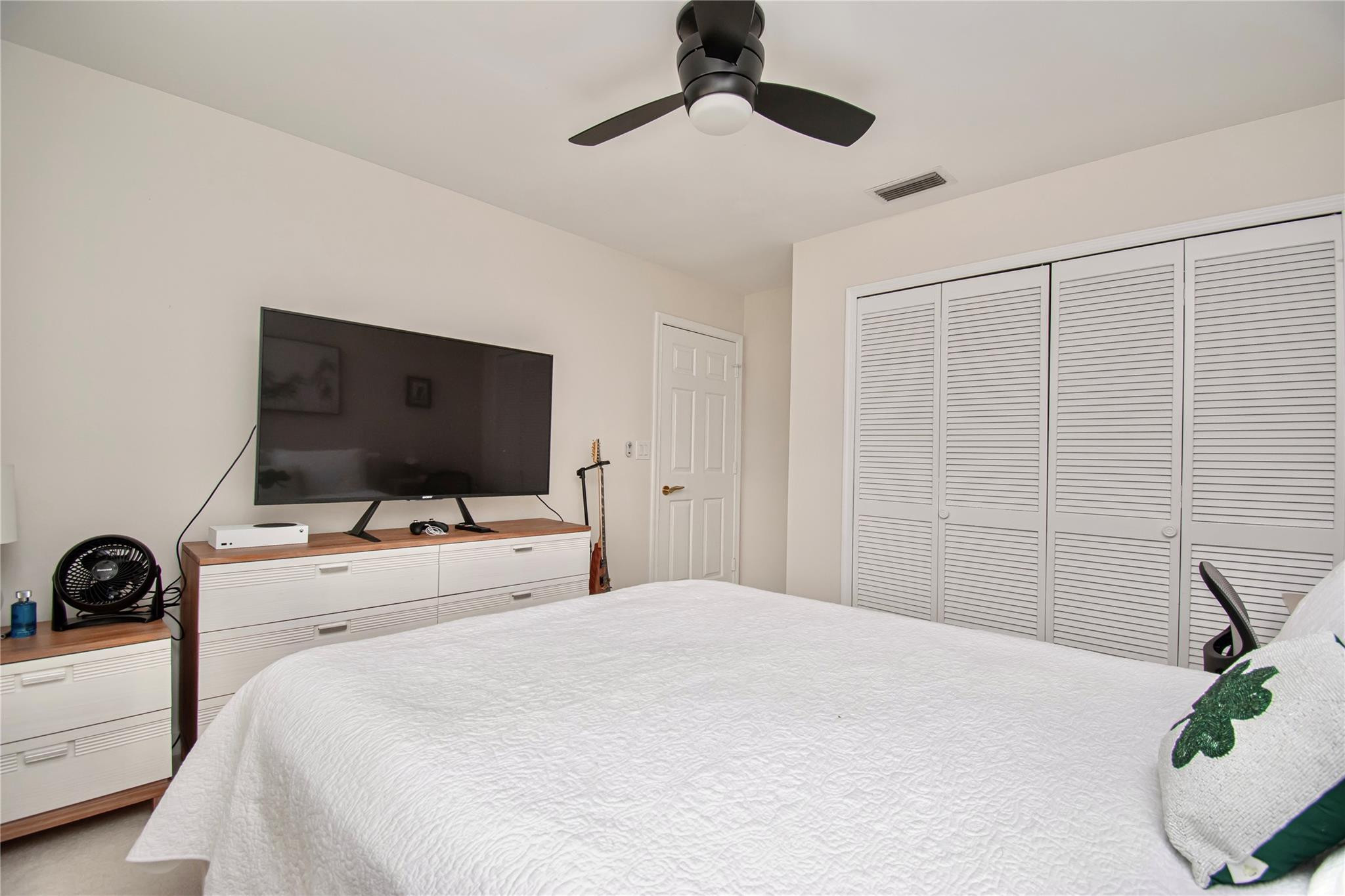 21694 Town Pl Drive Boca Raton, FL 33433 - Photo 43 of 55 a bedroom with a bed and a flat screen tv