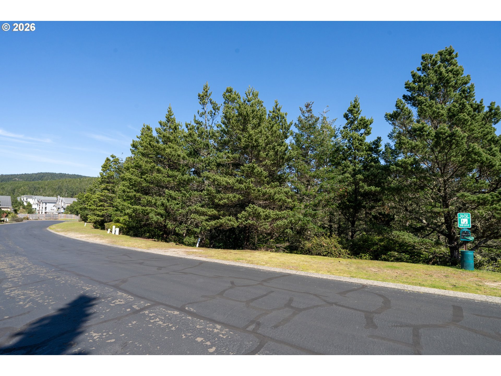 Promontory Lane, Unit 169 Tillamook, OR 97141 - Photo 7 of 22 a view of a yard with an tree and a yard