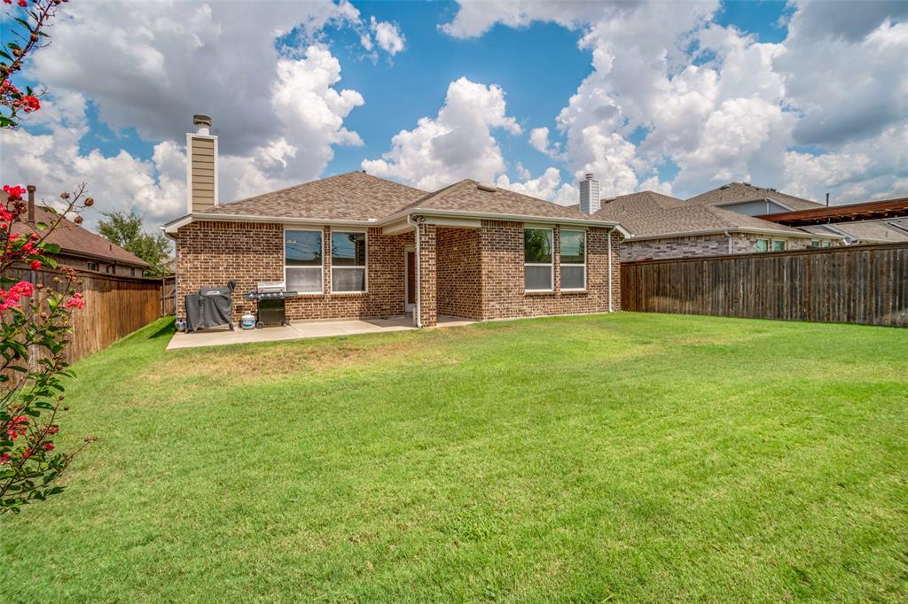 512 Barnstorm Drive Prosper, TX 75078 - Photo 24 of 25 a view of a house with a yard and sitting area