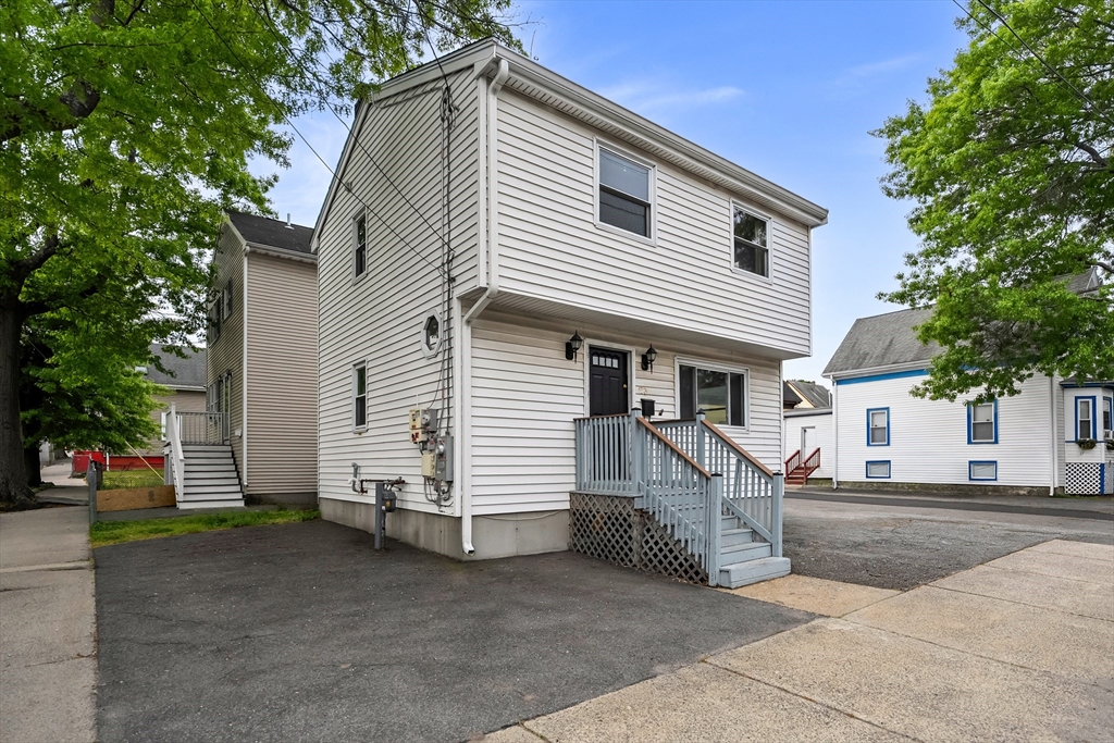 23 Logan Street Lynn, MA 01902 - Photo 3 of 27 a view of a house with a street