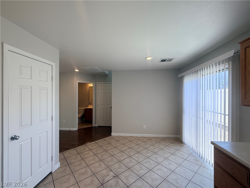 11953 Fairfax Ridge Street Las Vegas, NV 89183 - Photo 16 of 32 Functional kitchen with ample counter space and access to outdoor areas.