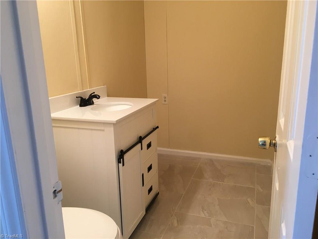 640 Kanoy Road Thomasville, NC 27360 - Photo 21 of 24 Downstairs 1/2 bath . This is the original laundry area . It is now upstairs but the connections are still behind wall.