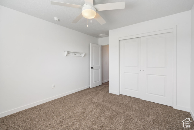 3456 South Linden Way Syracuse, UT 84075 - Photo 32 of 50 Unfurnished bedroom with carpet floors, a closet, baseboards, and a ceiling fan