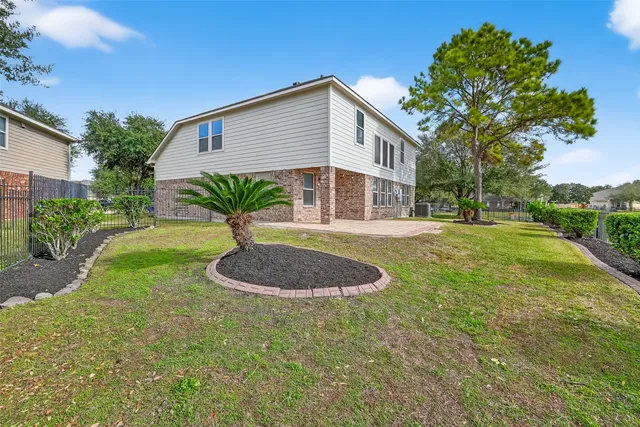 a view of a lake with houses in the background