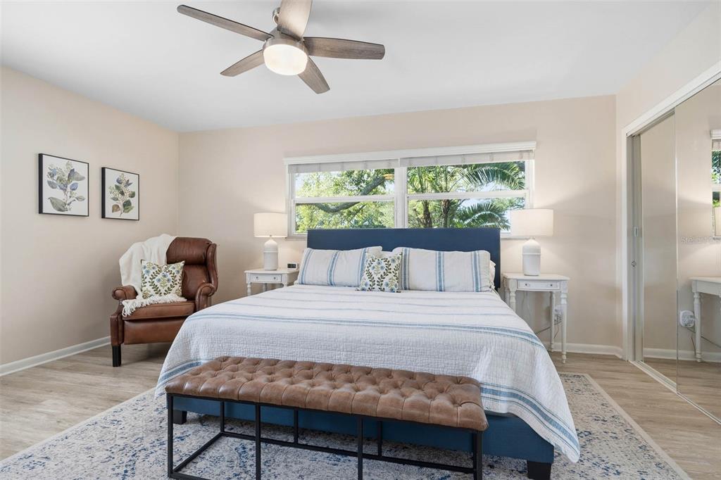 1218 Taylor Avenue Dunedin, FL 34698 - Photo 12 of 53 a bedroom with a bed chair and window