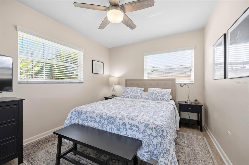 1218 Taylor Avenue Dunedin, FL 34698 - Photo 16 of 53 a bedroom with a bed and a window