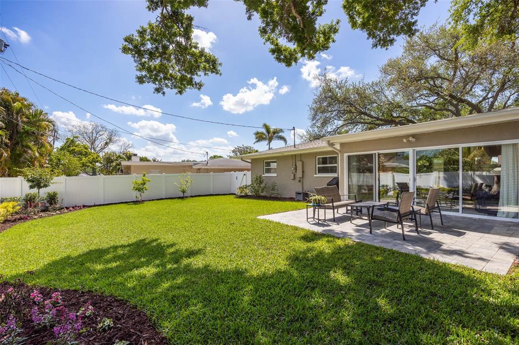 1218 Taylor Avenue Dunedin, FL 34698 - Photo 20 of 53 a view of a backyard with sitting area and garden