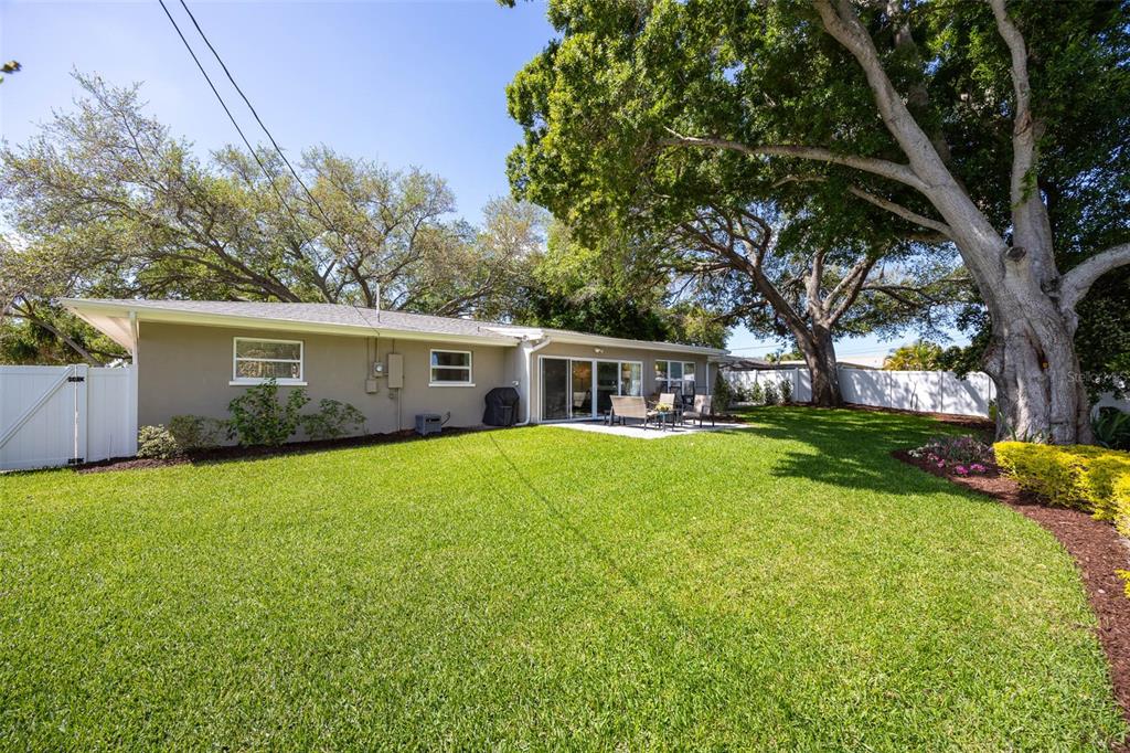 1218 Taylor Avenue Dunedin, FL 34698 - Photo 21 of 53 a front view of house with yard and green space