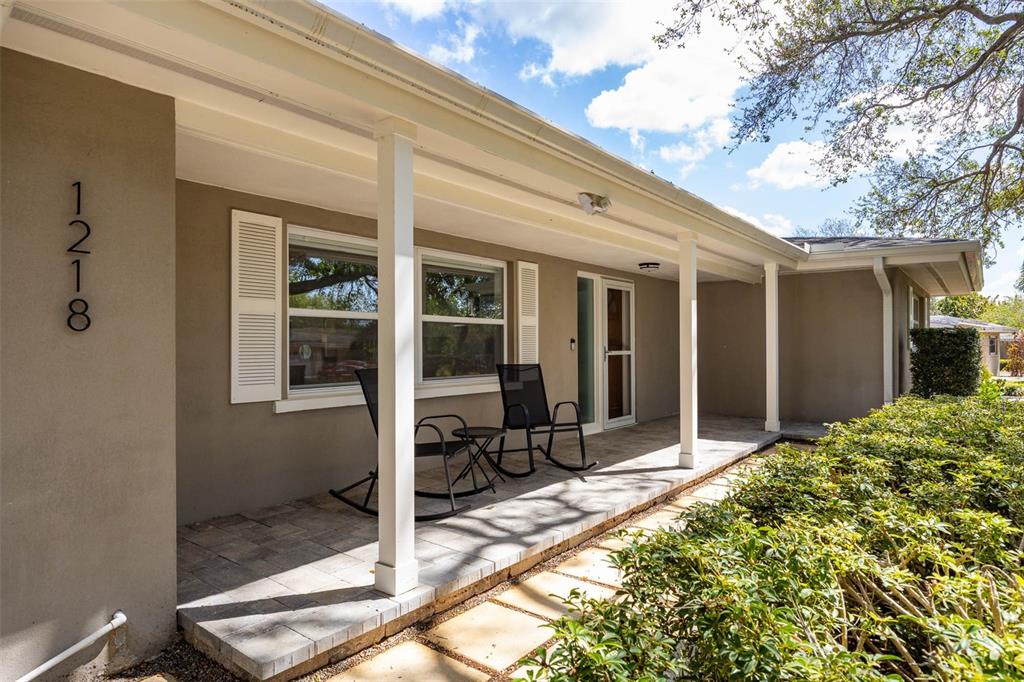 1218 Taylor Avenue Dunedin, FL 34698 - Photo 22 of 53 a view of house with backyard