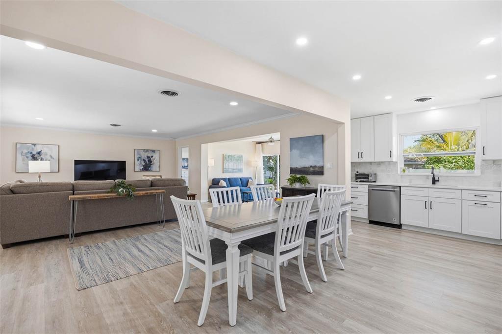 1218 Taylor Avenue Dunedin, FL 34698 - Photo 37 of 53 a kitchen with a table and chairs in it