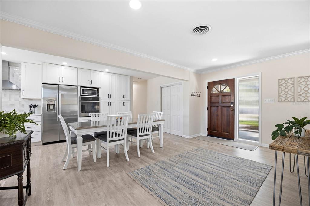 1218 Taylor Avenue Dunedin, FL 34698 - Photo 40 of 53 a view of a dining room with furniture and wooden floor