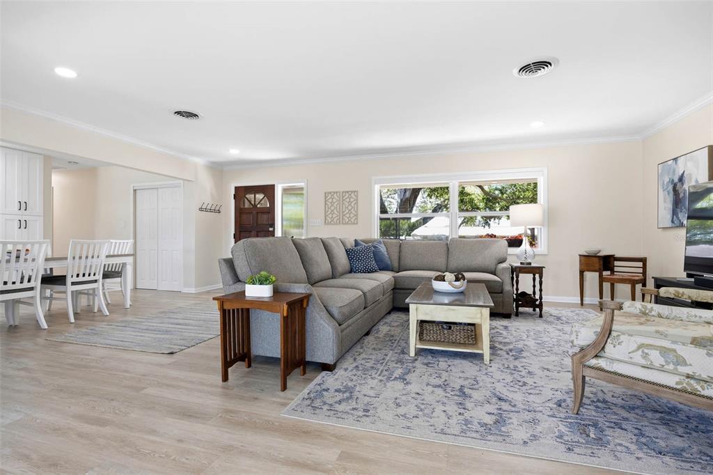 1218 Taylor Avenue Dunedin, FL 34698 - Photo 41 of 53 a living room with furniture potted plant and a window