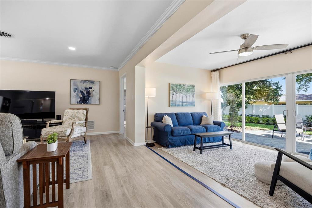 1218 Taylor Avenue Dunedin, FL 34698 - Photo 43 of 53 a living room with furniture and a flat screen tv