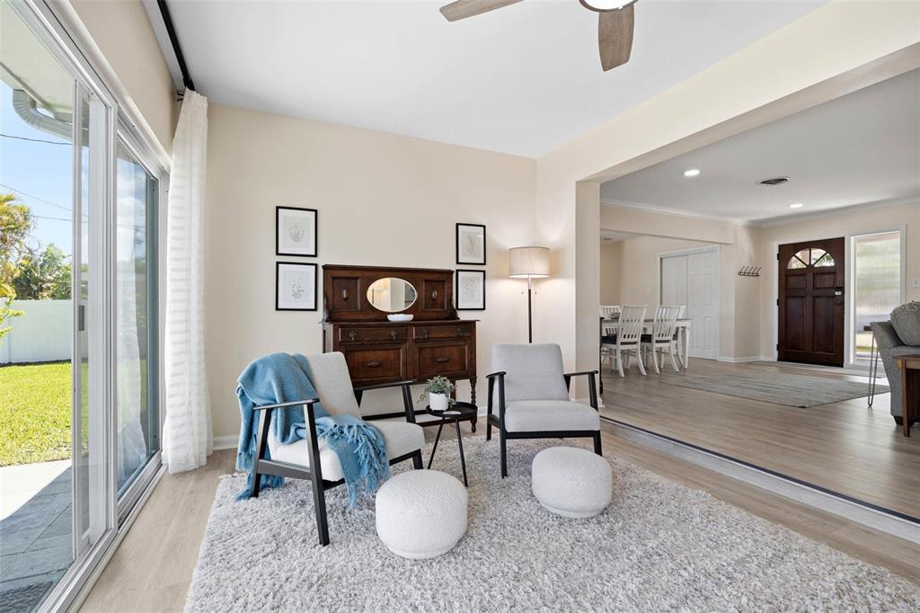 1218 Taylor Avenue Dunedin, FL 34698 - Photo 44 of 53 a living room with furniture and a wooden floor