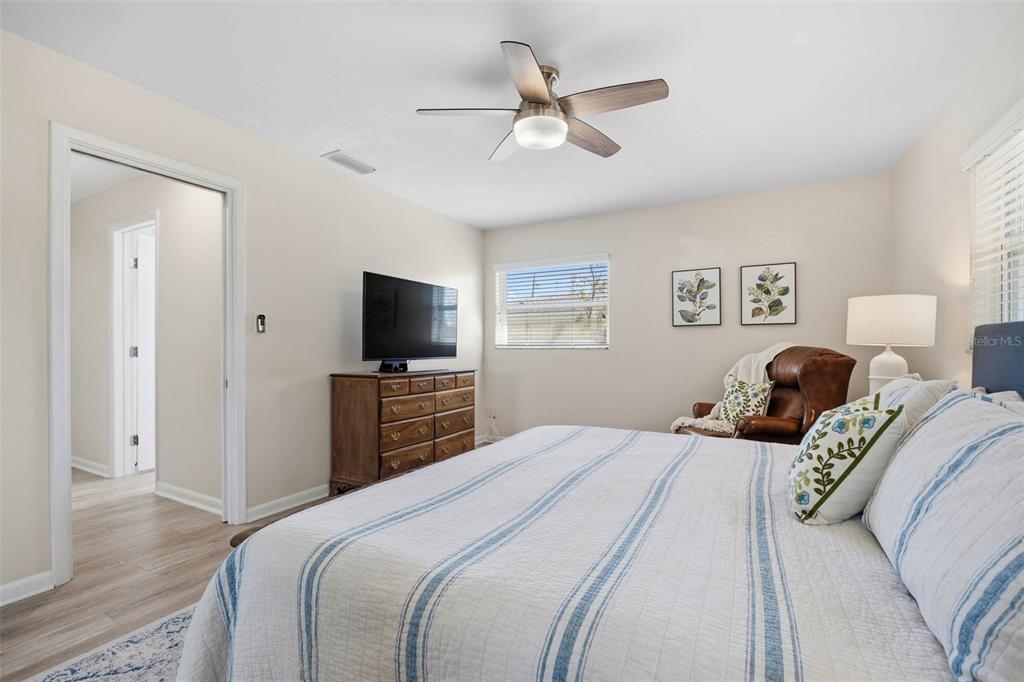 1218 Taylor Avenue Dunedin, FL 34698 - Photo 48 of 53 a bedroom with a bed and a flat screen tv