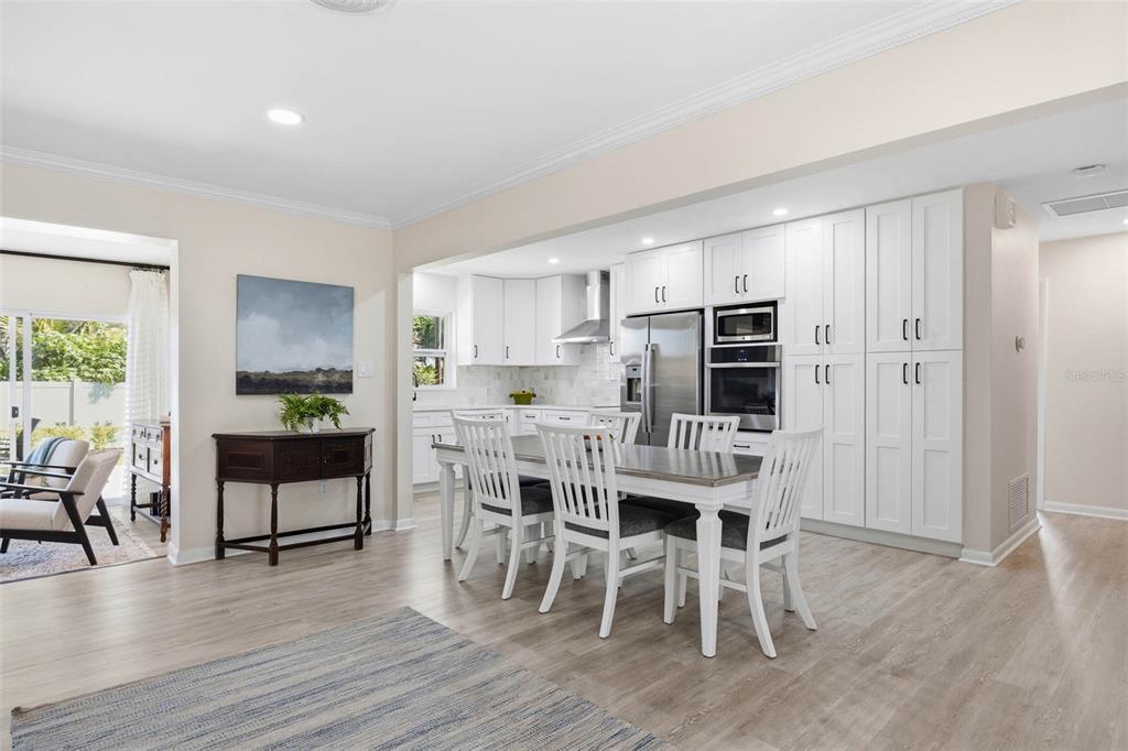 1218 Taylor Avenue Dunedin, FL 34698 - Photo 5 of 53 a view of a dining room with furniture window and wooden floor