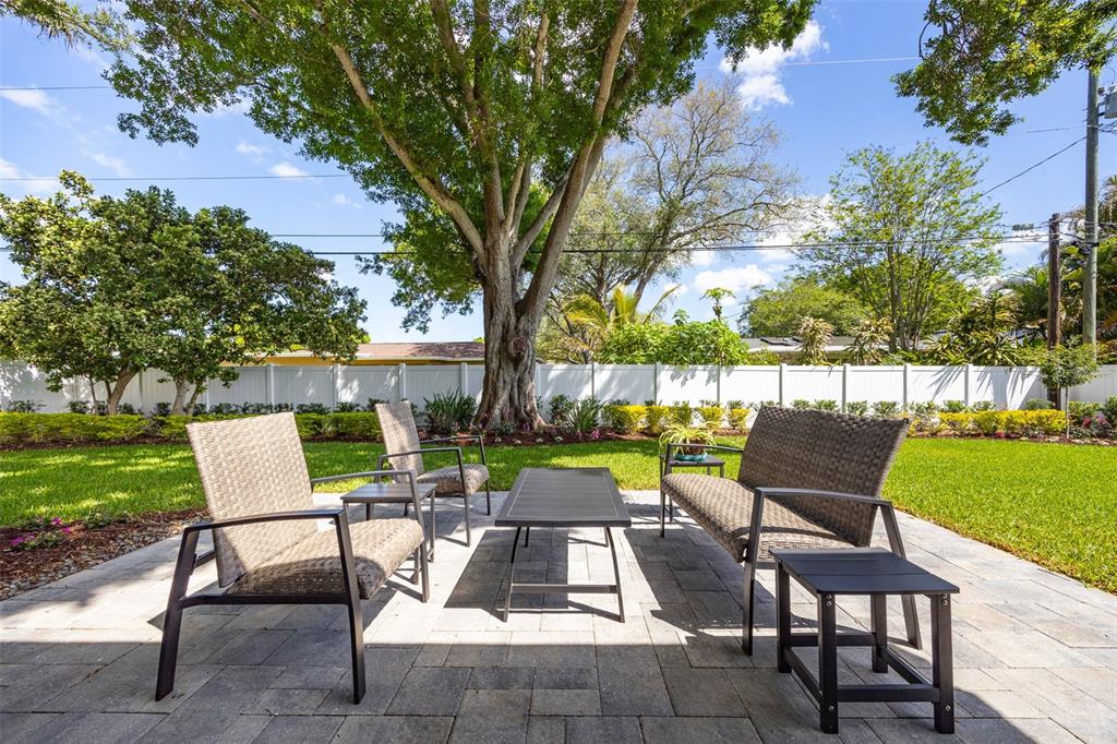1218 Taylor Avenue Dunedin, FL 34698 - Photo 51 of 53 a view of backyard with outdoor seating ad green space