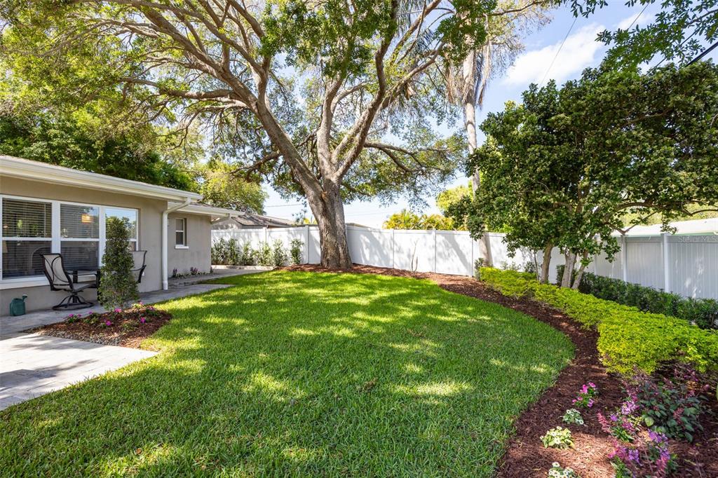 1218 Taylor Avenue Dunedin, FL 34698 - Photo 52 of 53 a view of a house with backyard and sitting area
