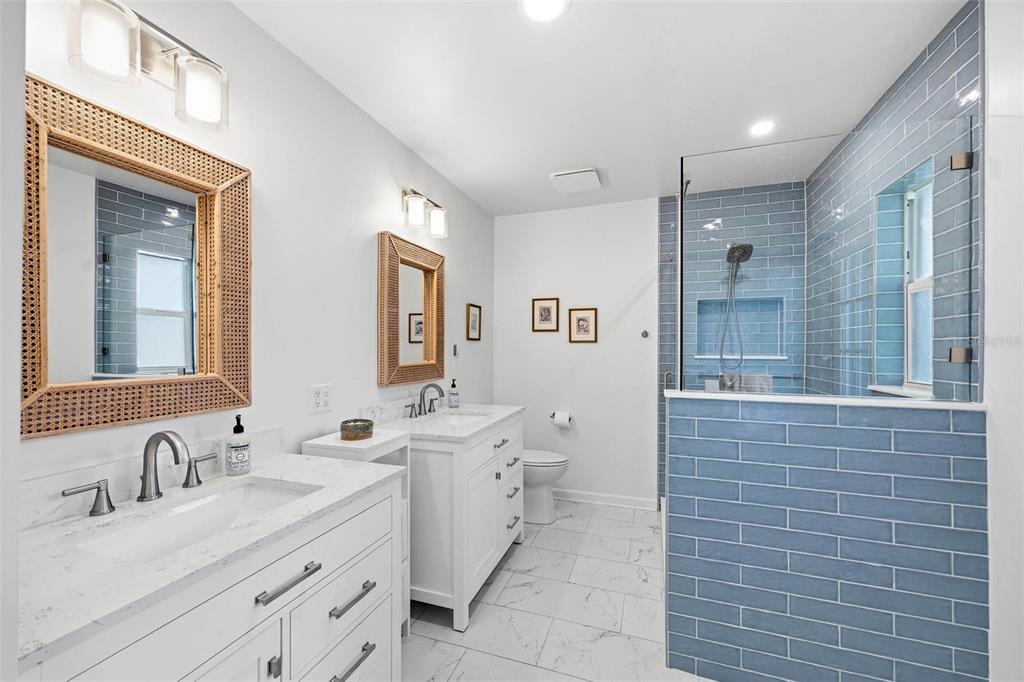 1218 Taylor Avenue Dunedin, FL 34698 - Photo 10 of 53 a bathroom with a double vanity sink mirror and double