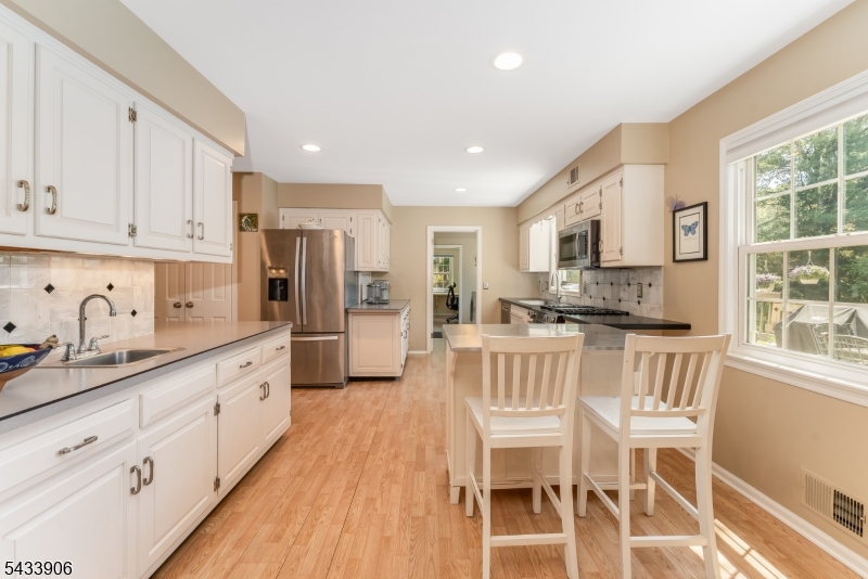 14 Lexington Road Annandale, NJ 08801 - Photo 13 of 47 a kitchen with white cabinets and stainless steel appliances