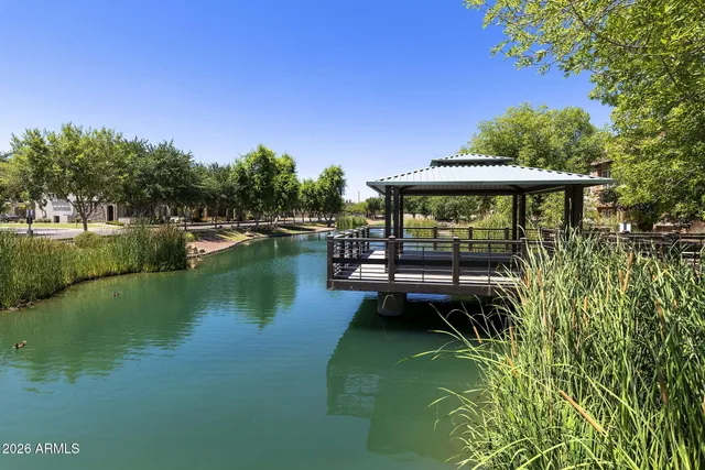 a view of a swimming pool with a yard