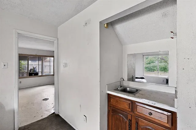 a kitchen with a sink and cabinets